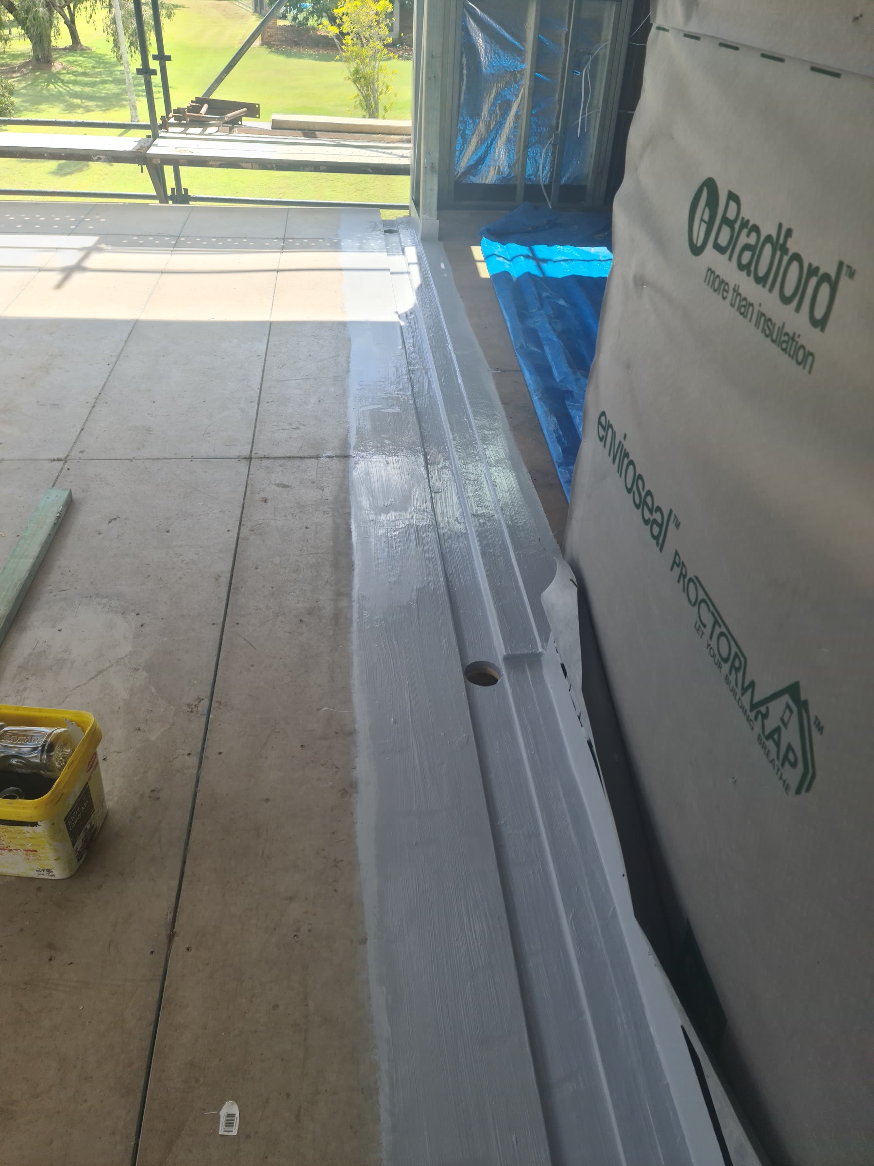 Balcony outdoor area with perimeter channel and floor drain